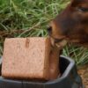 bulk cattle mineral lick blocks stacked on pallets for farm supply